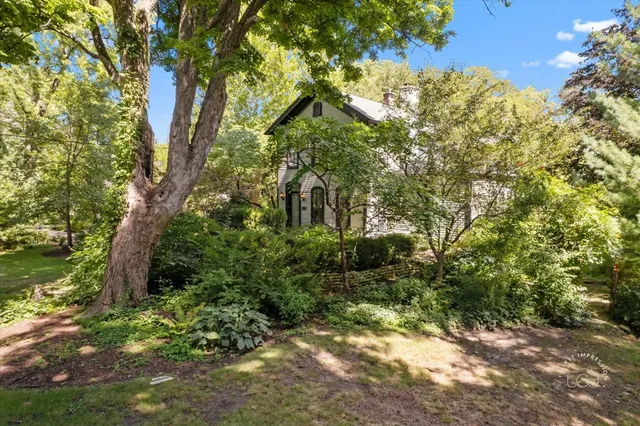 a backyard of a house with lots of green space