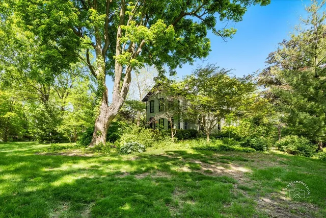 a backyard of a house with lots of green space
