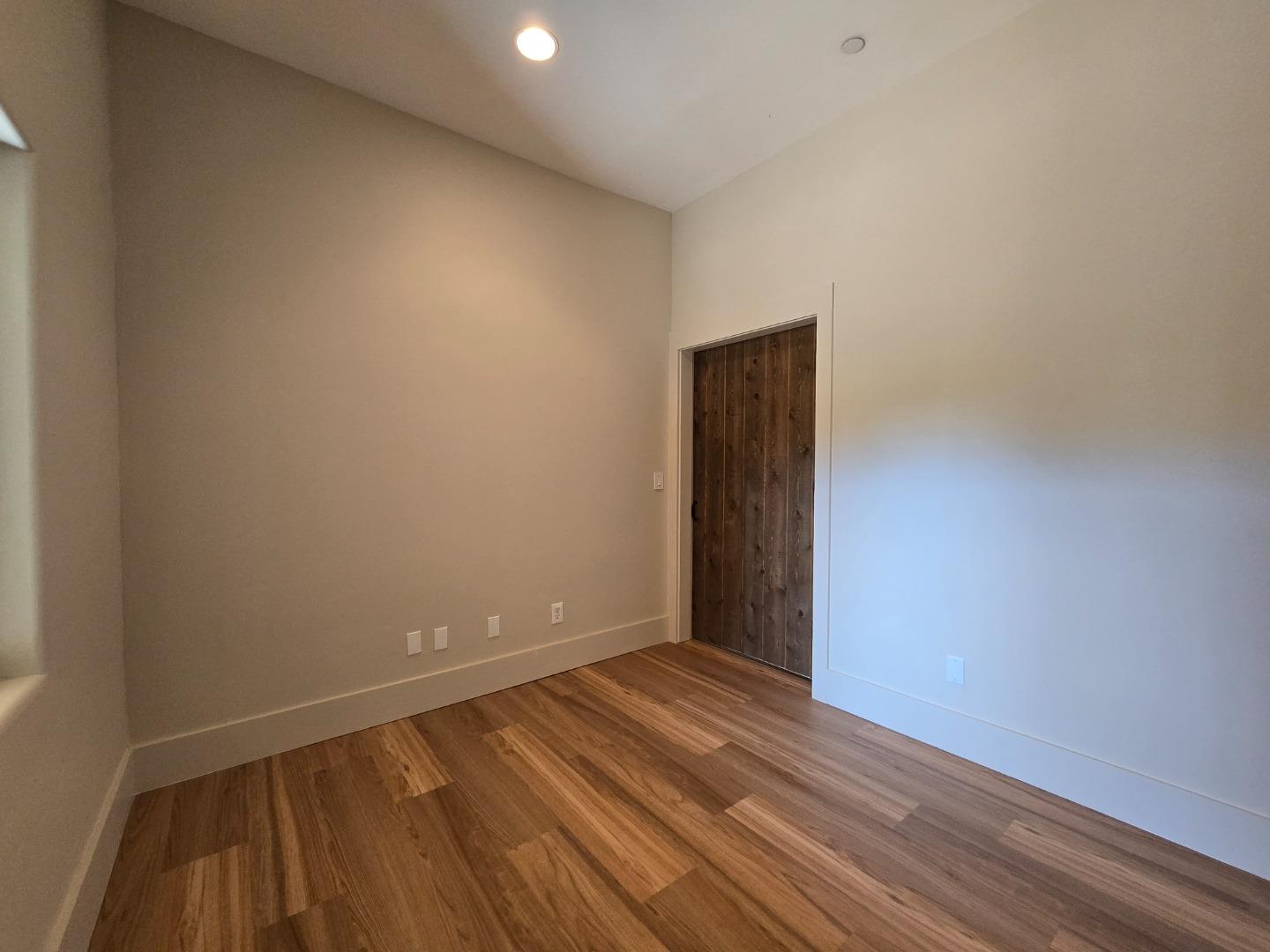 17329 McGuffie Road Salinas, CA 93907 - Photo 26 of 27 a view of an empty room with wooden floor