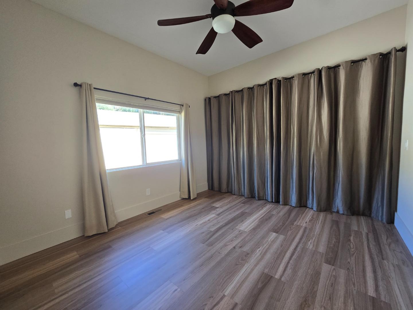 17329 McGuffie Road Salinas, CA 93907 - Photo 27 of 27 a view of wooden floor and windows in a room