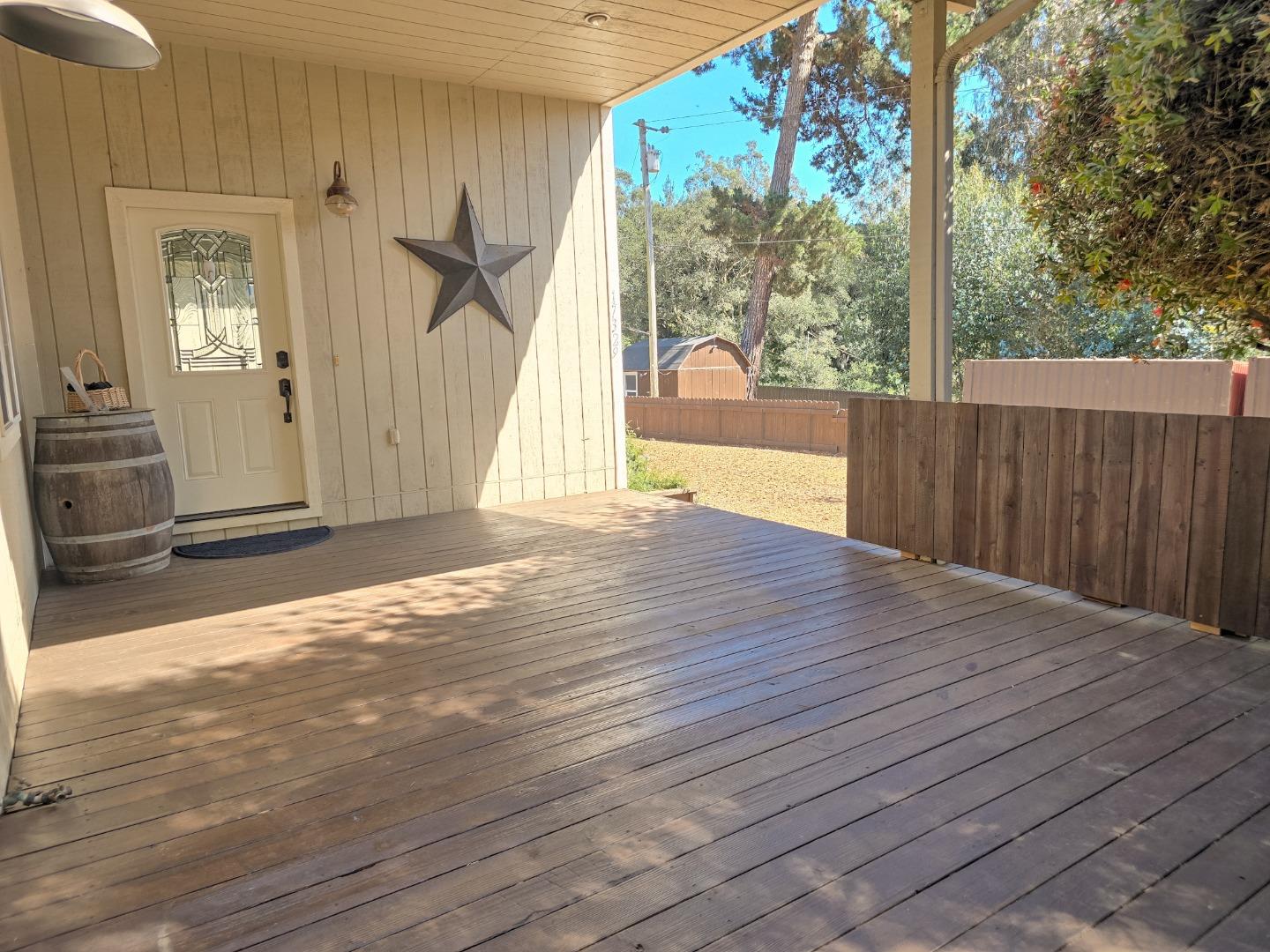 17329 McGuffie Road Salinas, CA 93907 - Photo 8 of 27 a view of backyard with glass door and wooden floor
