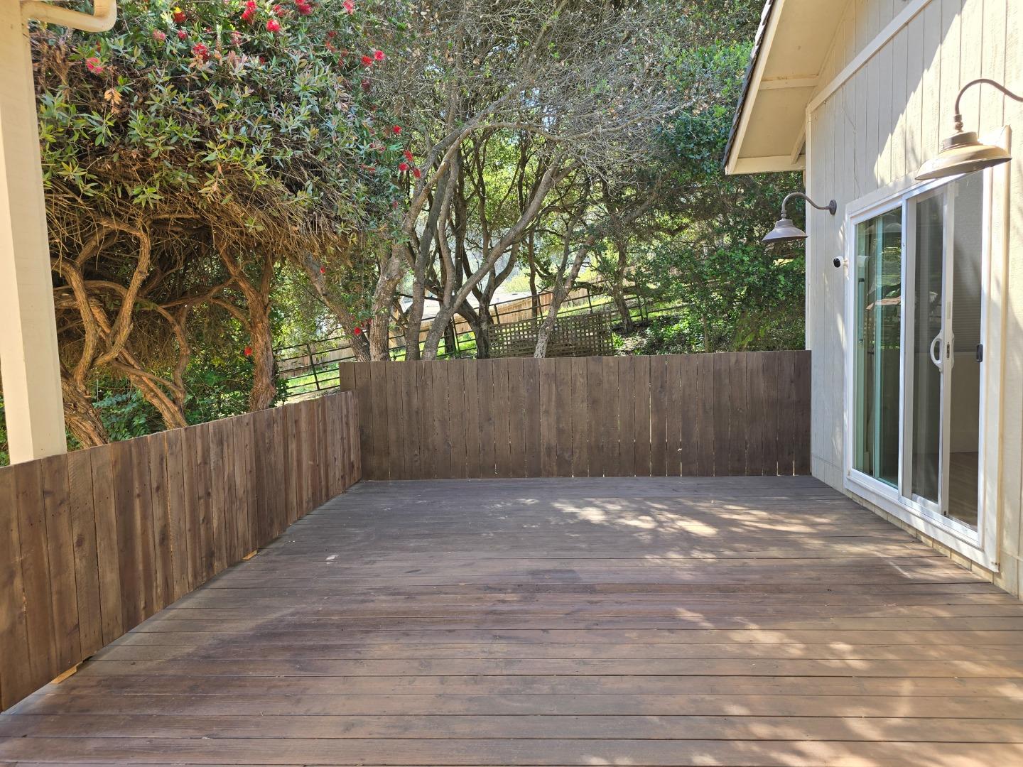 17329 McGuffie Road Salinas, CA 93907 - Photo 9 of 27 a view of backyard with wooden fence and trees