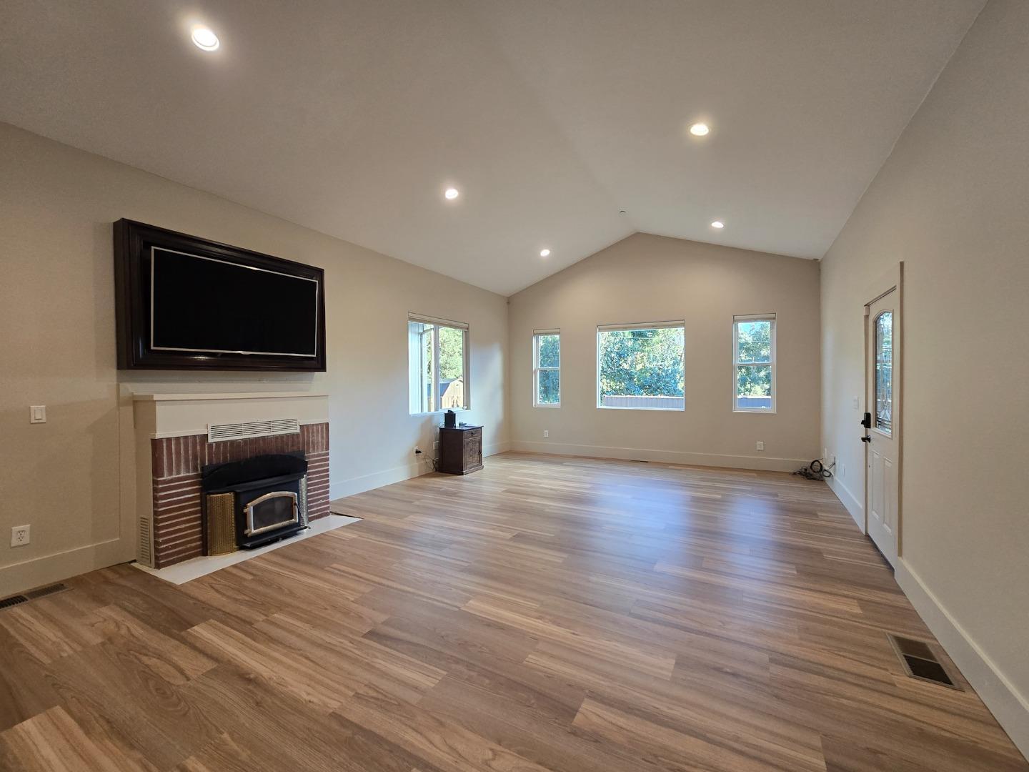 17329 McGuffie Road Salinas, CA 93907 - Photo 10 of 27 a view of a livingroom with a fireplace window and wooden floor