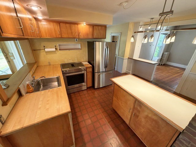 60 Massasoit Street Northampton, MA 01060 - Photo 4 of 19 a kitchen with refrigerator and countertop