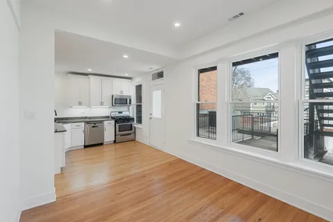 a view of kitchen with wooden floor