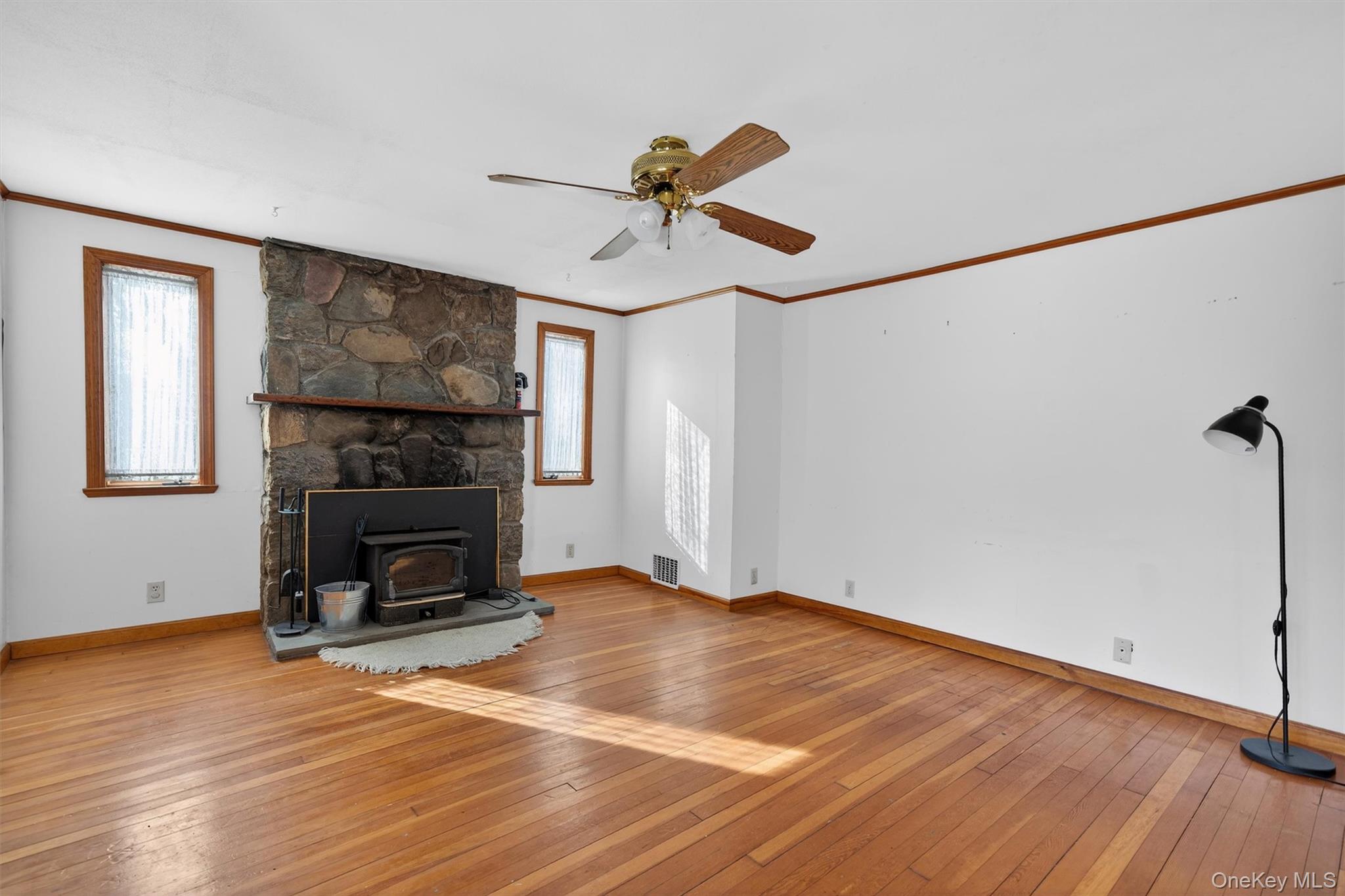 101 Highland Road Monroe, NY 10950 - Photo 8 of 50 Living room with wood burning stove insert in fireplace