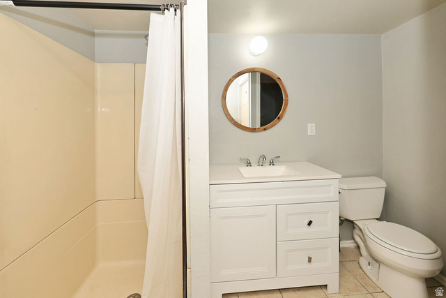 669 Colonial Avenue Layton, UT 84041 - Photo 25 of 51 White vanity with an integrated sink and chrome fixtures