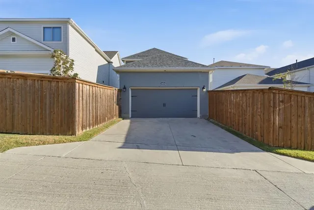 a front view of a house with garage