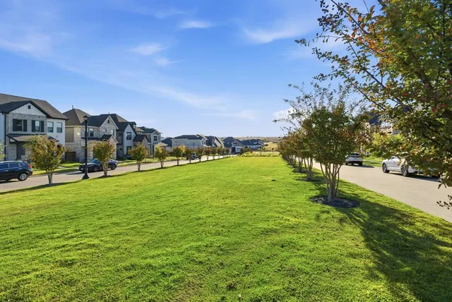 a view of a town with mountains in the background