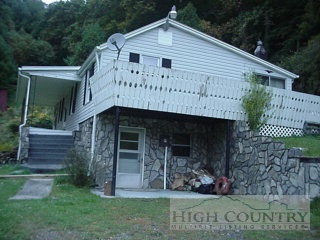 346 Tucker Road Lansing, NC 28643 - Photo 1 of 1 a front view of a house with garden