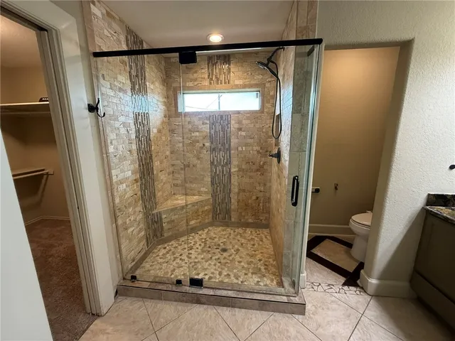 a bathroom with a shower and a tub