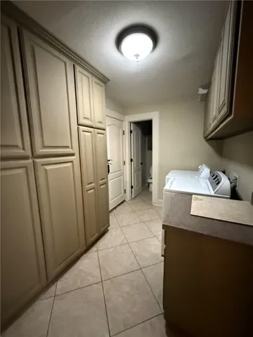 a kitchen with stainless steel appliances granite countertop a refrigerator a sink and a stove