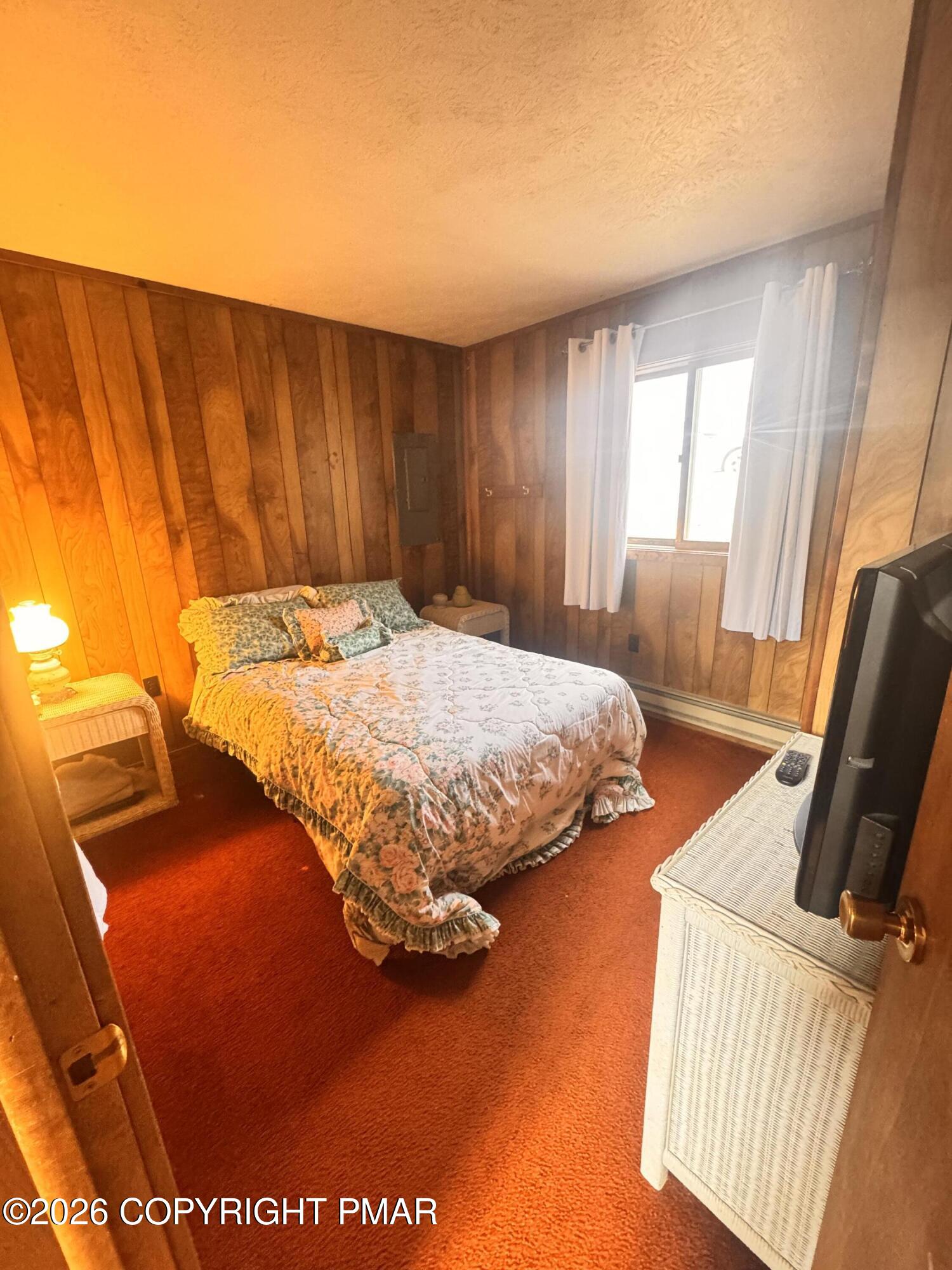 166 Dover Drive Bushkill, PA 18324 - Photo 11 of 21 a bedroom with a bed and flat screen tv