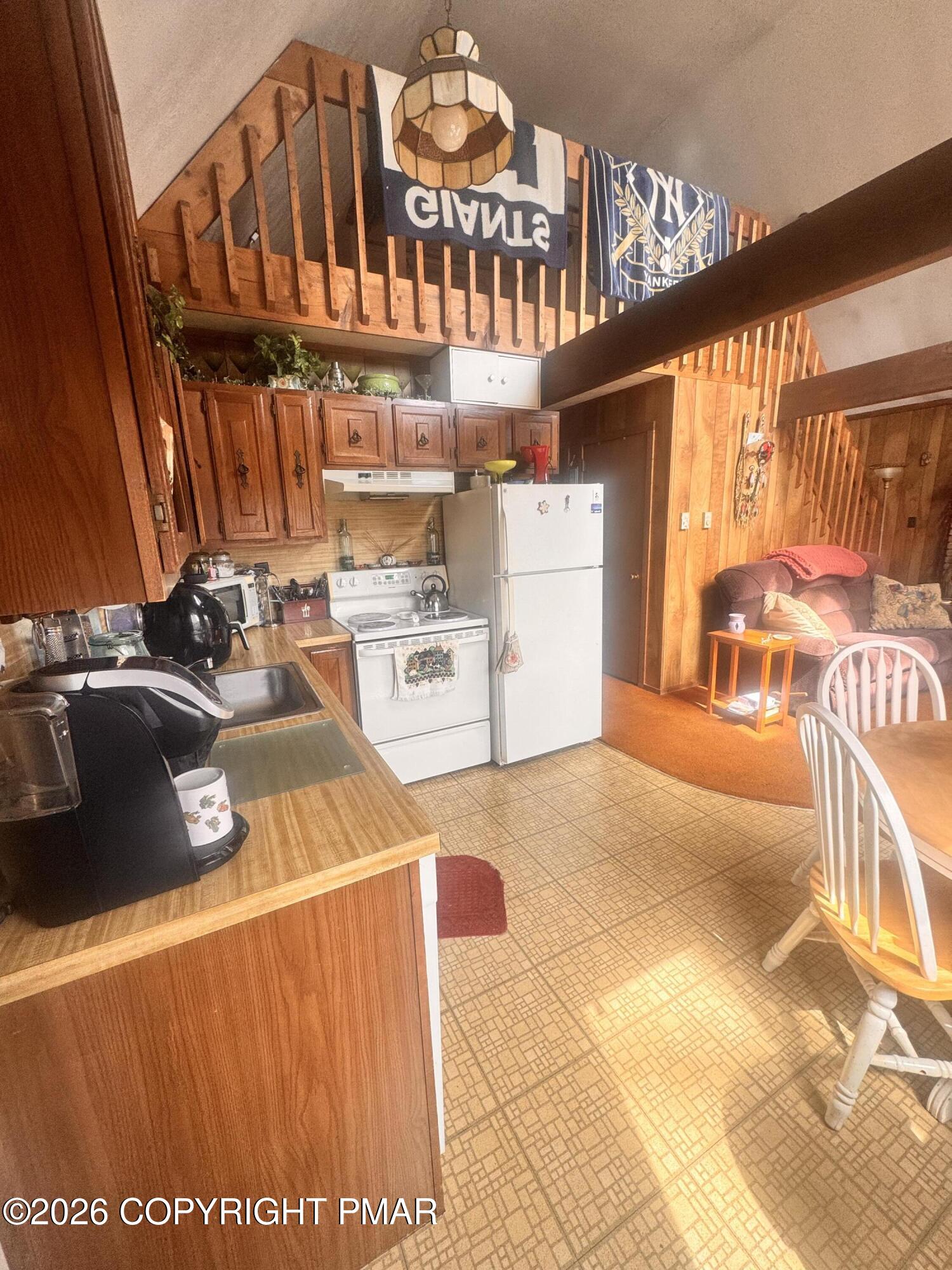 166 Dover Drive Bushkill, PA 18324 - Photo 4 of 21 a view of a kitchen with furniture and a window