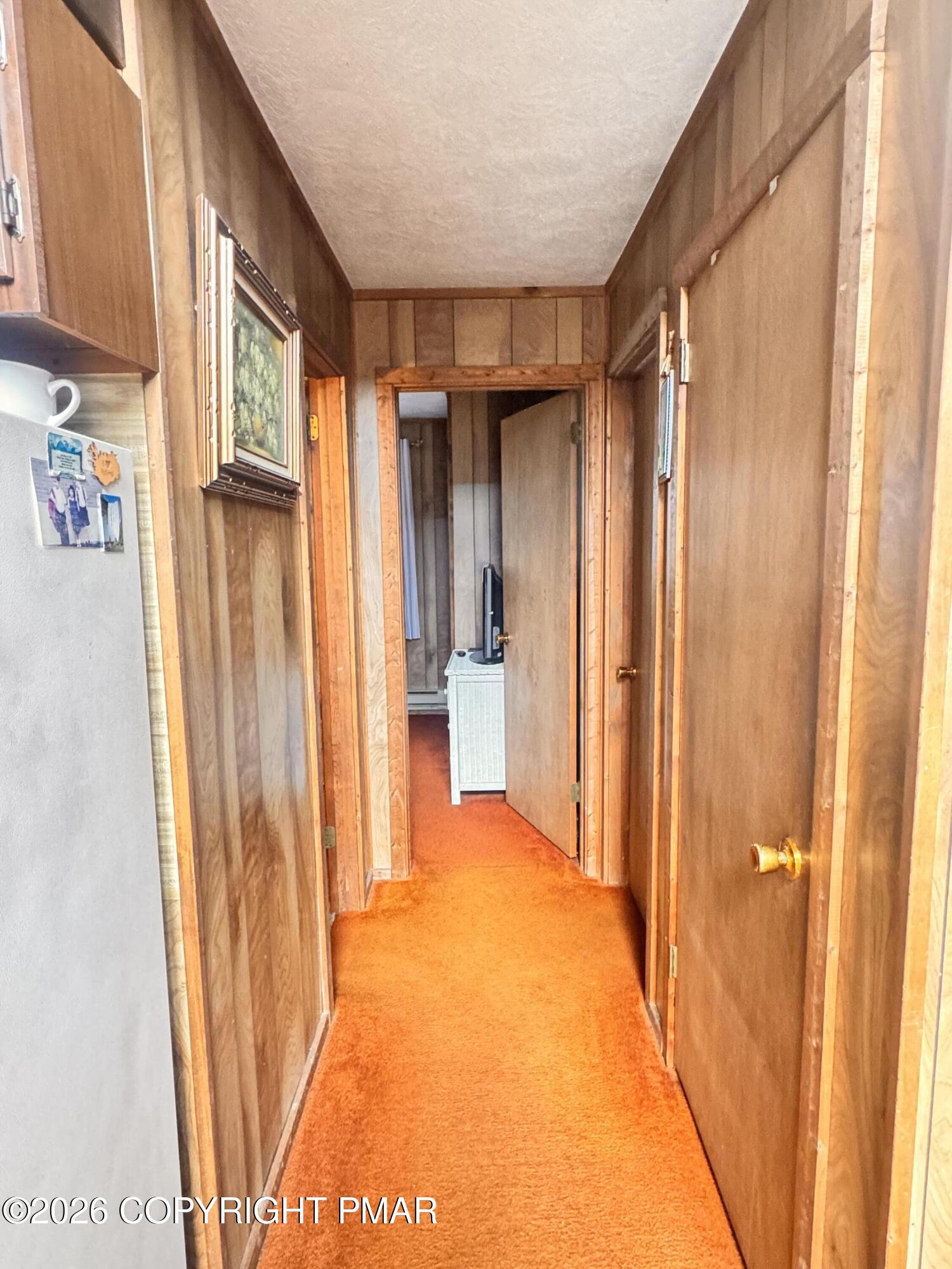 166 Dover Drive Bushkill, PA 18324 - Photo 9 of 21 a view of a hallway with wooden shelves