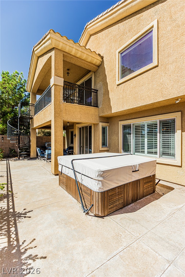 75 Tall Ruff Drive Las Vegas, NV 89148 - Photo 53 of 64 Multi-level concrete patios and upper balconies frame this stucco exterior with integrated spa.