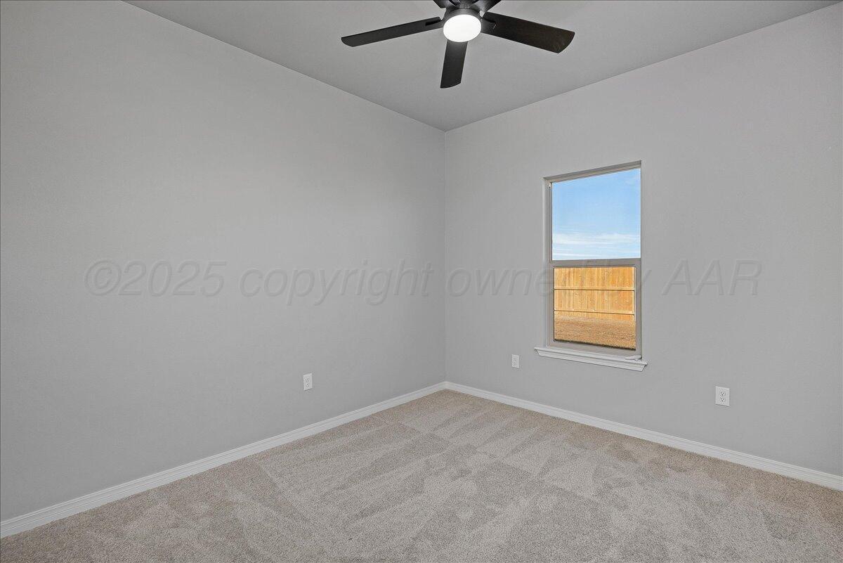 4300 Beacon Road Amarillo, TX 79118 - Photo 17 of 20 an empty room with a window and a fan