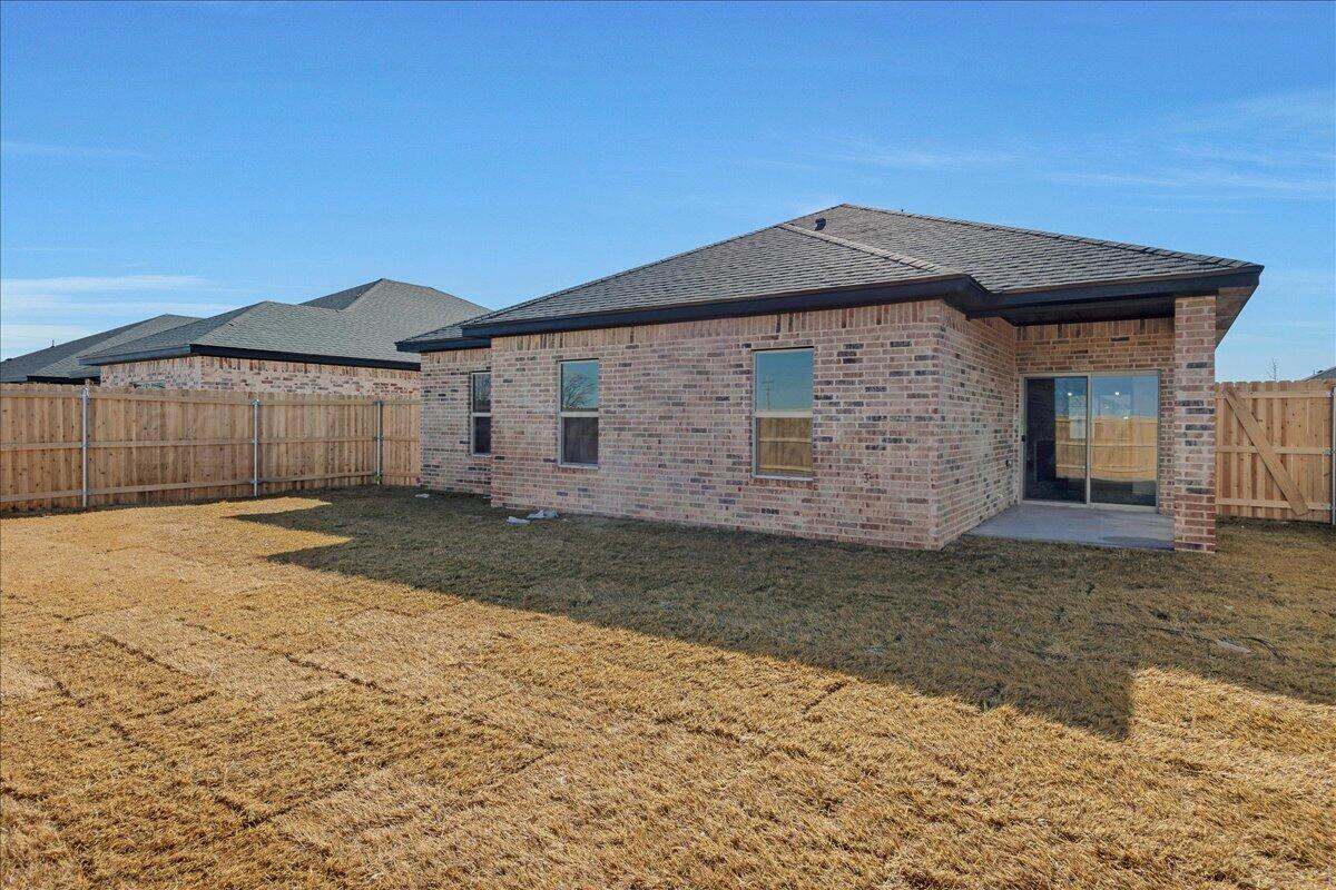 4300 Beacon Road Amarillo, TX 79118 - Photo 19 of 20 a front view of a house with a yard and garage