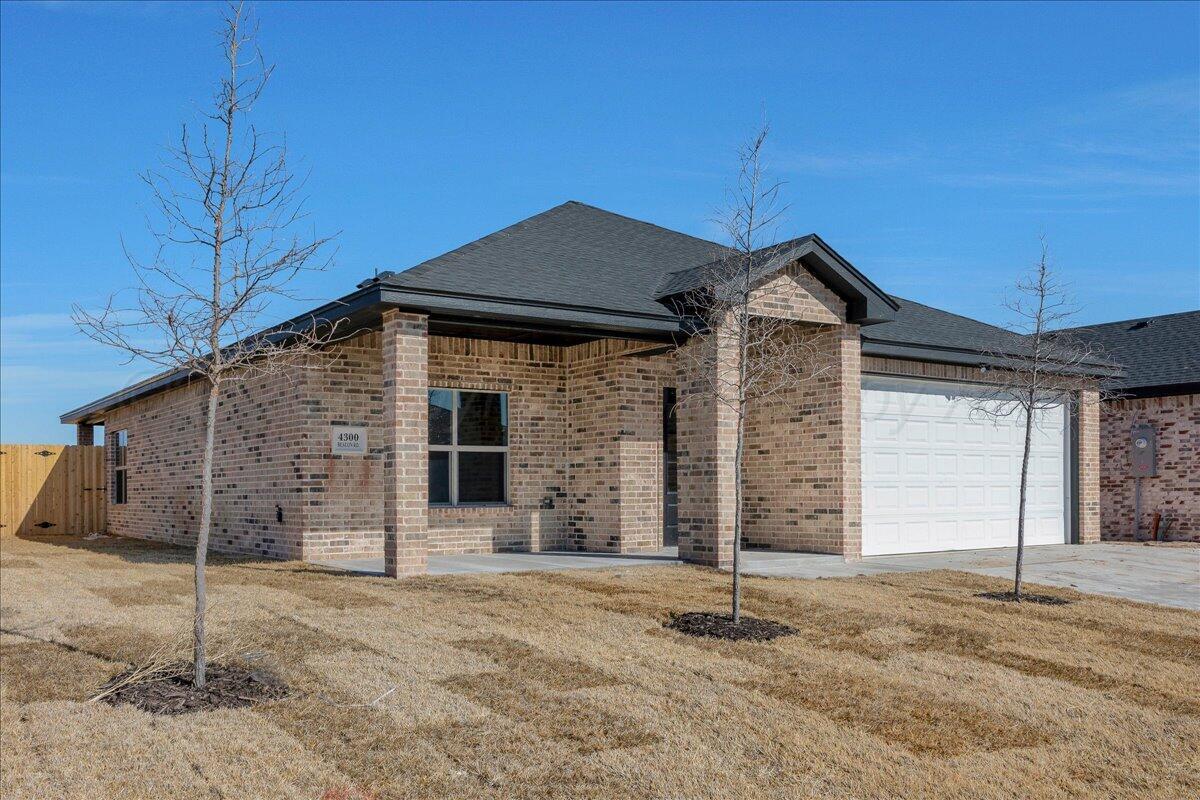 4300 Beacon Road Amarillo, TX 79118 - Photo 2 of 20 a front view of a house with a garage