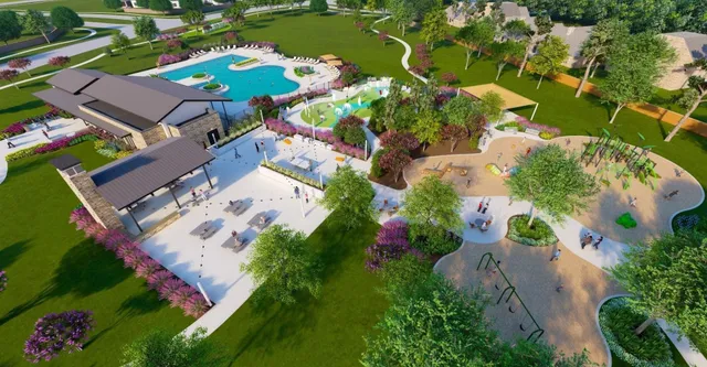 an aerial view of a swimming pool with a yard and outdoor seating