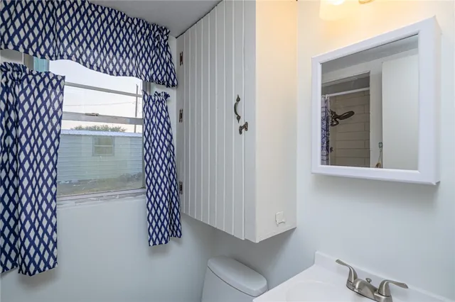 a bathroom with a sink and mirror