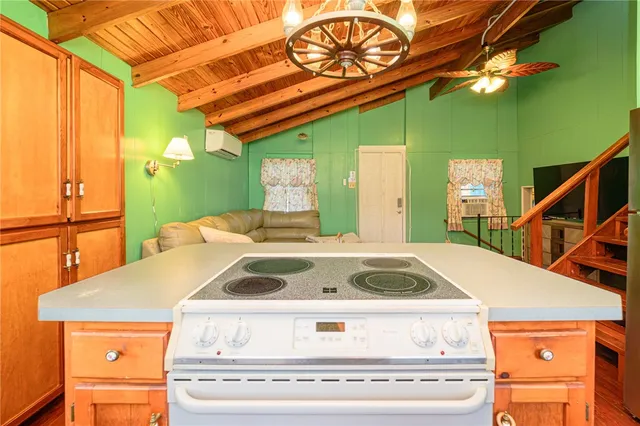 a bathroom with a granite countertop sink toilet and a large mirror