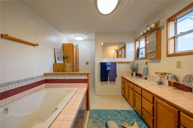 a kitchen with a refrigerator and a sink