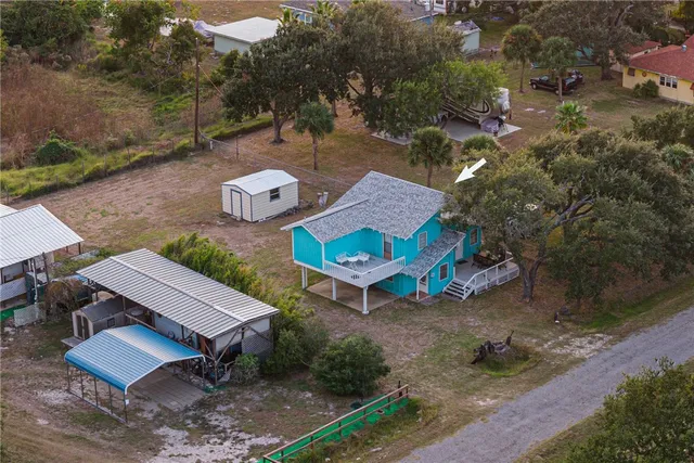 a aerial view of a house with outdoor space