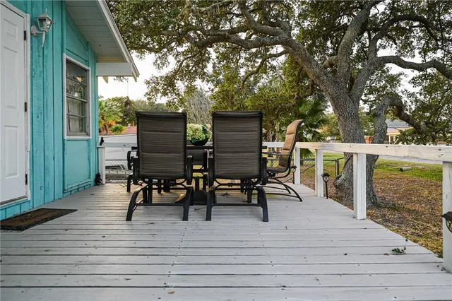 a view of a terrace with furniture and wooden floor