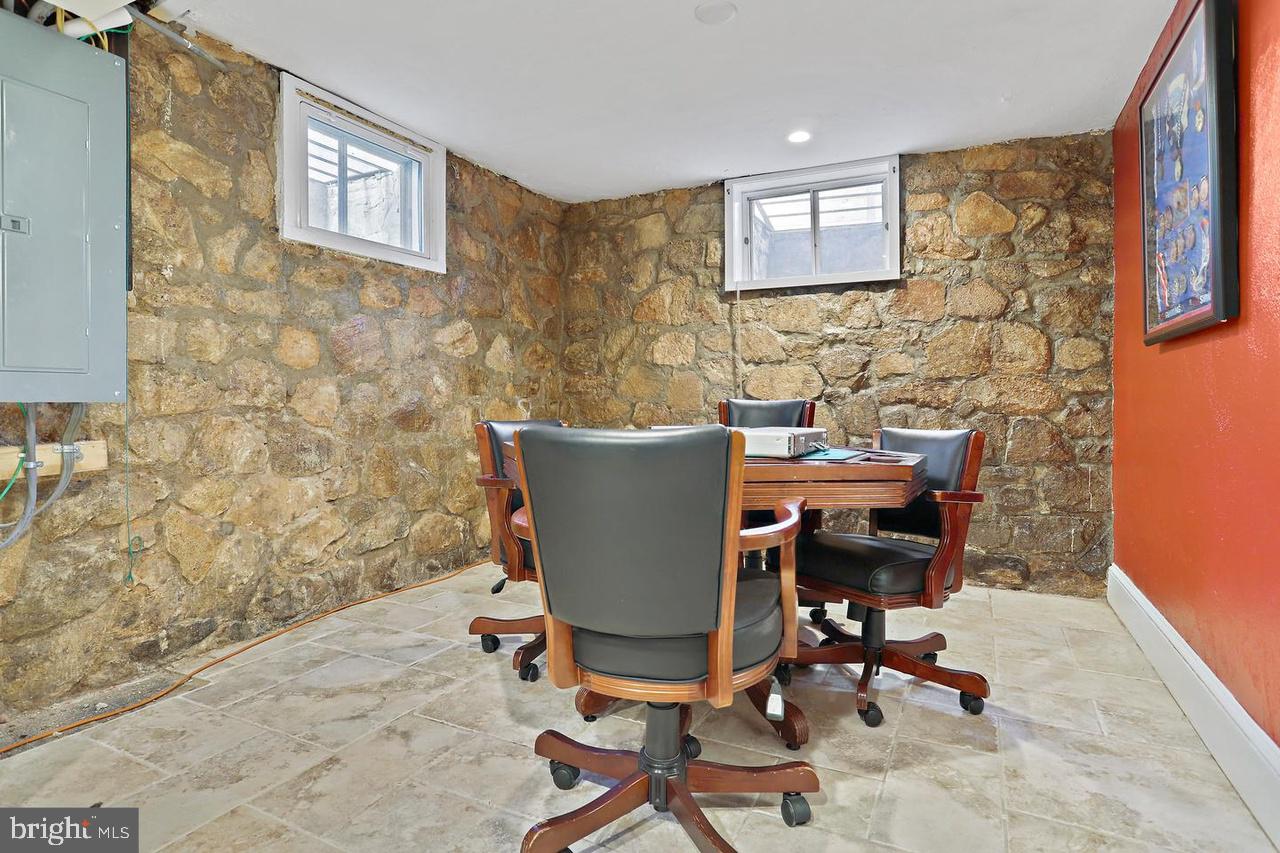 2347 South Arlington Ridge Road Arlington, VA 22202 - Photo 25 of 42 Cozy meeting space with stone walls.