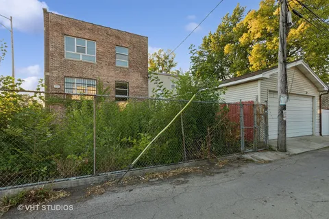 a backyard of a house with plants and trees