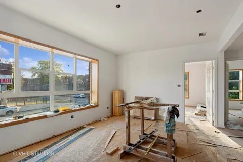 a room with gym equipment and a large window