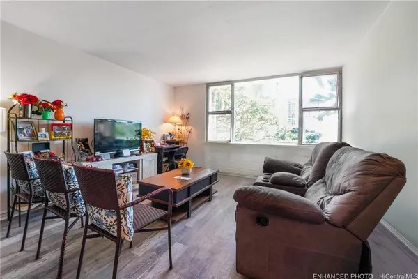a living room with furniture and a window