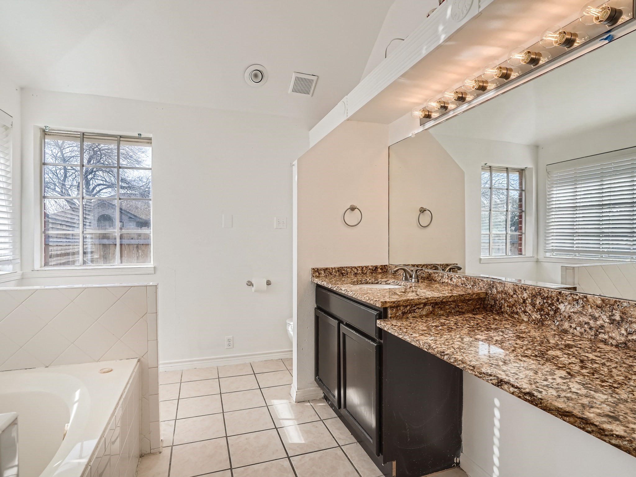 811 Canyon Bend Road Pflugerville, TX 78660 - Photo 6 of 11 a kitchen with a stove top oven and cabinets