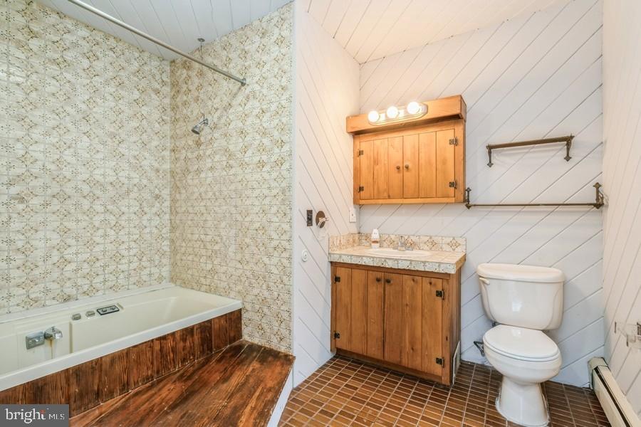 16 Railroad Place Pennington, NJ 08534 - Photo 11 of 14 a bathroom with a sink a toilet and shower