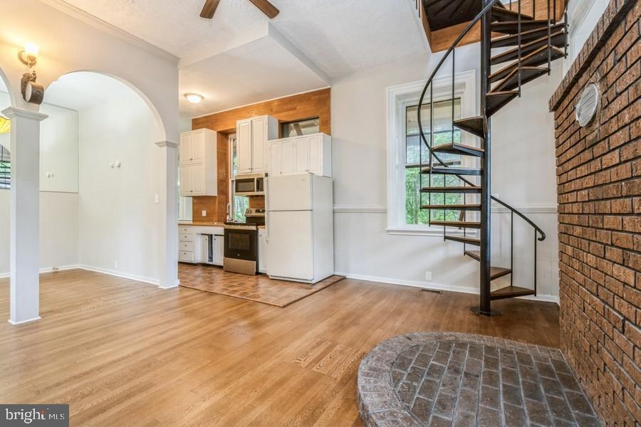 16 Railroad Place Pennington, NJ 08534 - Photo 2 of 14 a view of entryway and hall with wooden floor