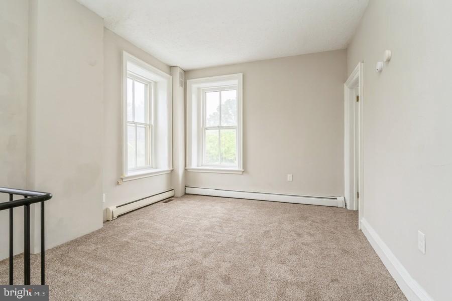 16 Railroad Place Pennington, NJ 08534 - Photo 9 of 14 an empty room with windows