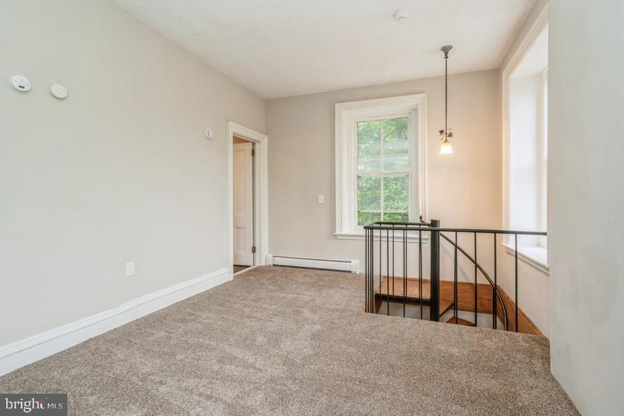 16 Railroad Place Pennington, NJ 08534 - Photo 10 of 14 an empty room with windows