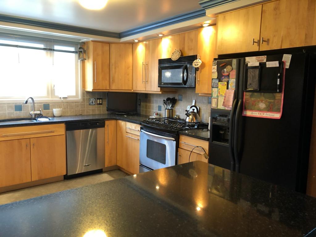 149 Wheeler Road Mashpee, MA 02649 - Photo 13 of 41 a kitchen with stainless steel appliances a sink dishwasher stove and refrigerator