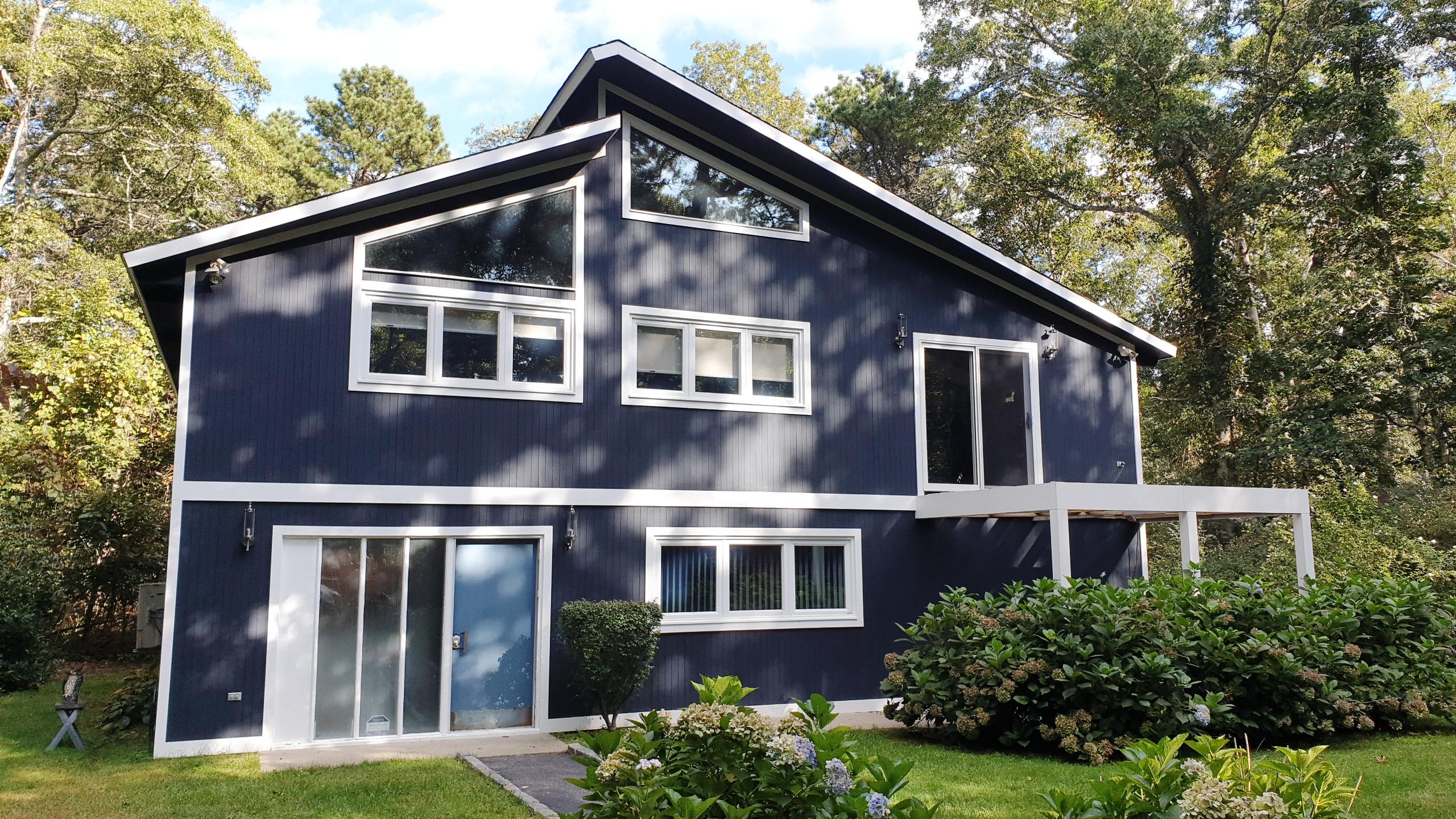 149 Wheeler Road Mashpee, MA 02649 - Photo 2 of 41 a front view of a house with a yard