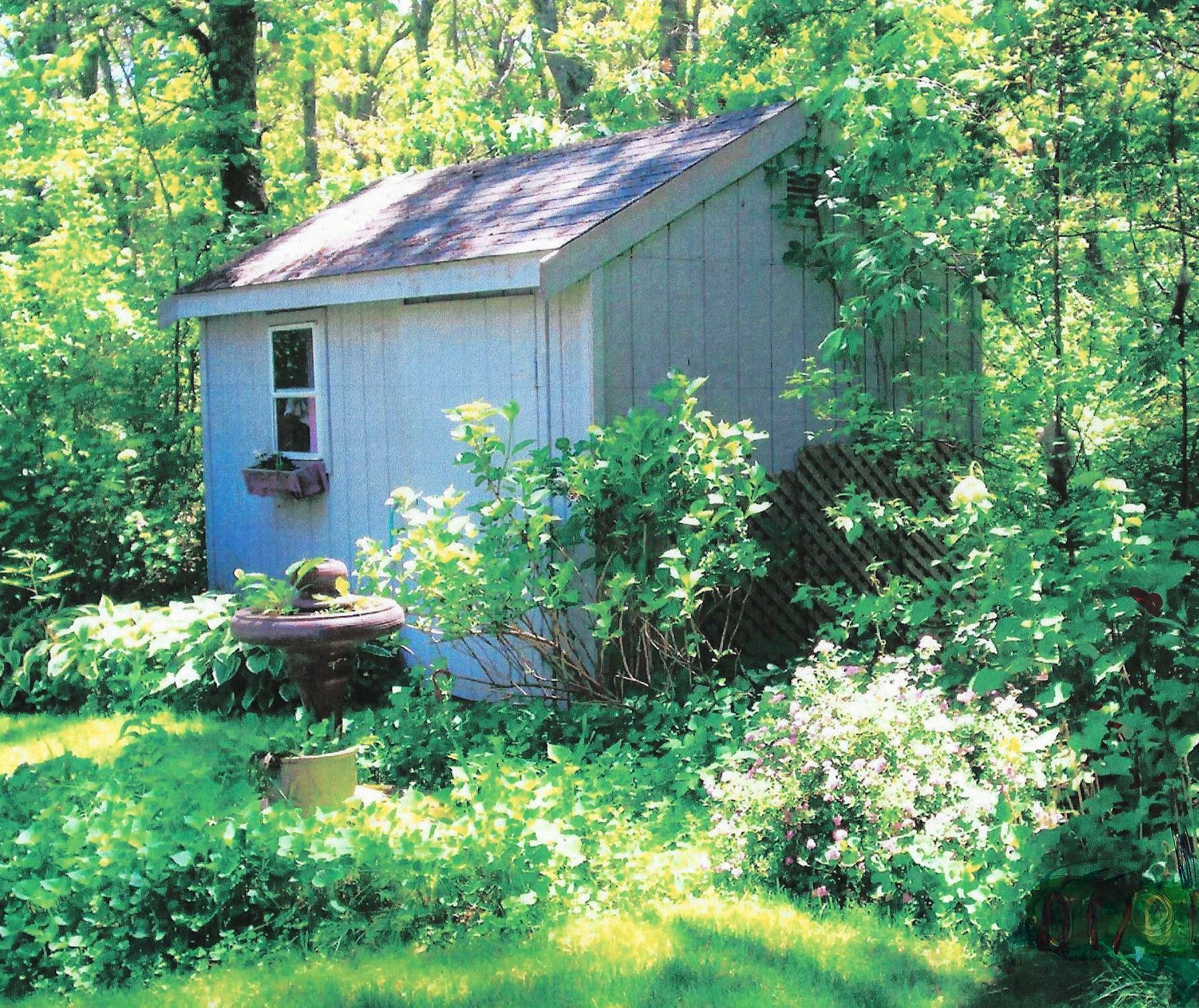149 Wheeler Road Mashpee, MA 02649 - Photo 30 of 41 a house view with a garden space
