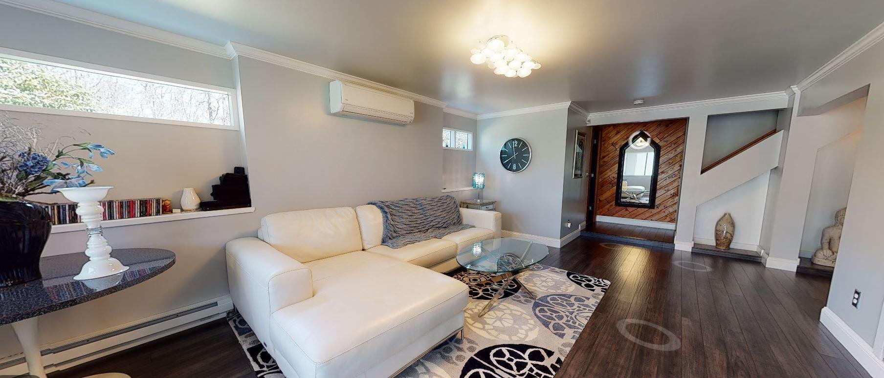 149 Wheeler Road Mashpee, MA 02649 - Photo 3 of 41 a living room with furniture and a wooden floor