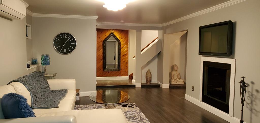 149 Wheeler Road Mashpee, MA 02649 - Photo 7 of 41 a living room with fireplace furniture and a wooden floor