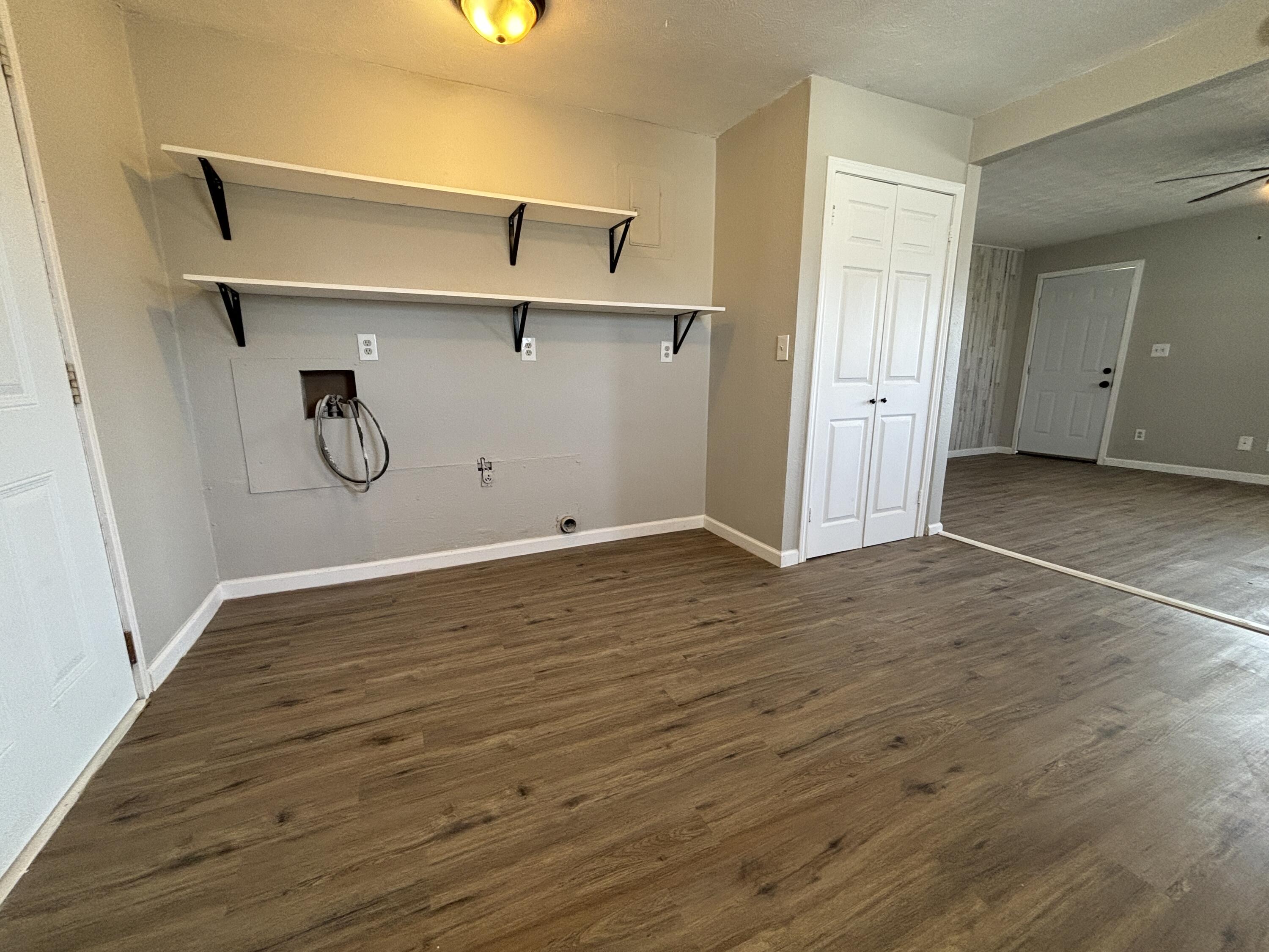4822 37th Street Lubbock, TX 79414 - Photo 5 of 12 a view of a room with wooden floor