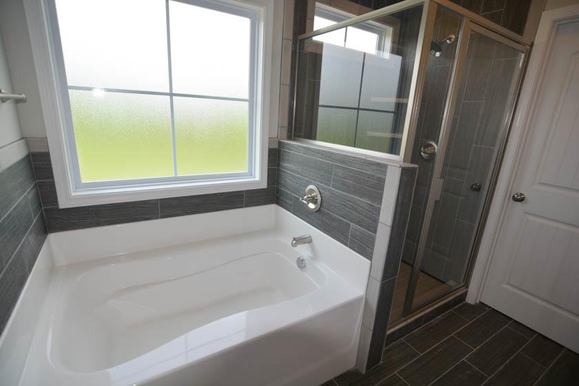 780 Grays Chapel Road Southside, TN 37171 - Photo 14 of 30 a bathroom with a bathtub and a shower