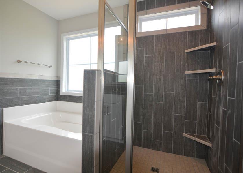 780 Grays Chapel Road Southside, TN 37171 - Photo 16 of 30 a bathroom with a bathtub and shower