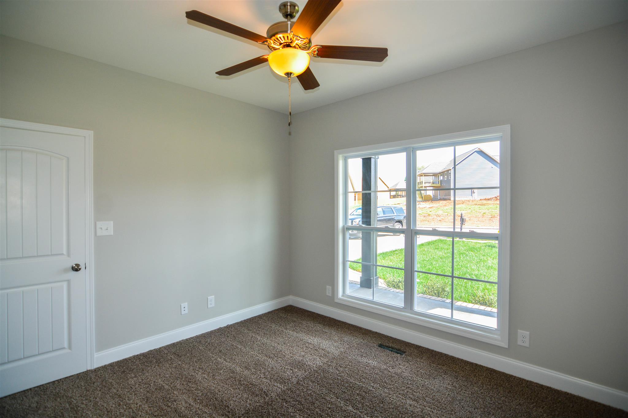 780 Grays Chapel Road Southside, TN 37171 - Photo 27 of 30 an empty room with a window and a fan