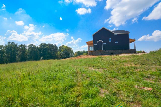 780 Grays Chapel Road Southside, TN 37171 - Photo 3 of 30 a view of a big yard with a house in the background