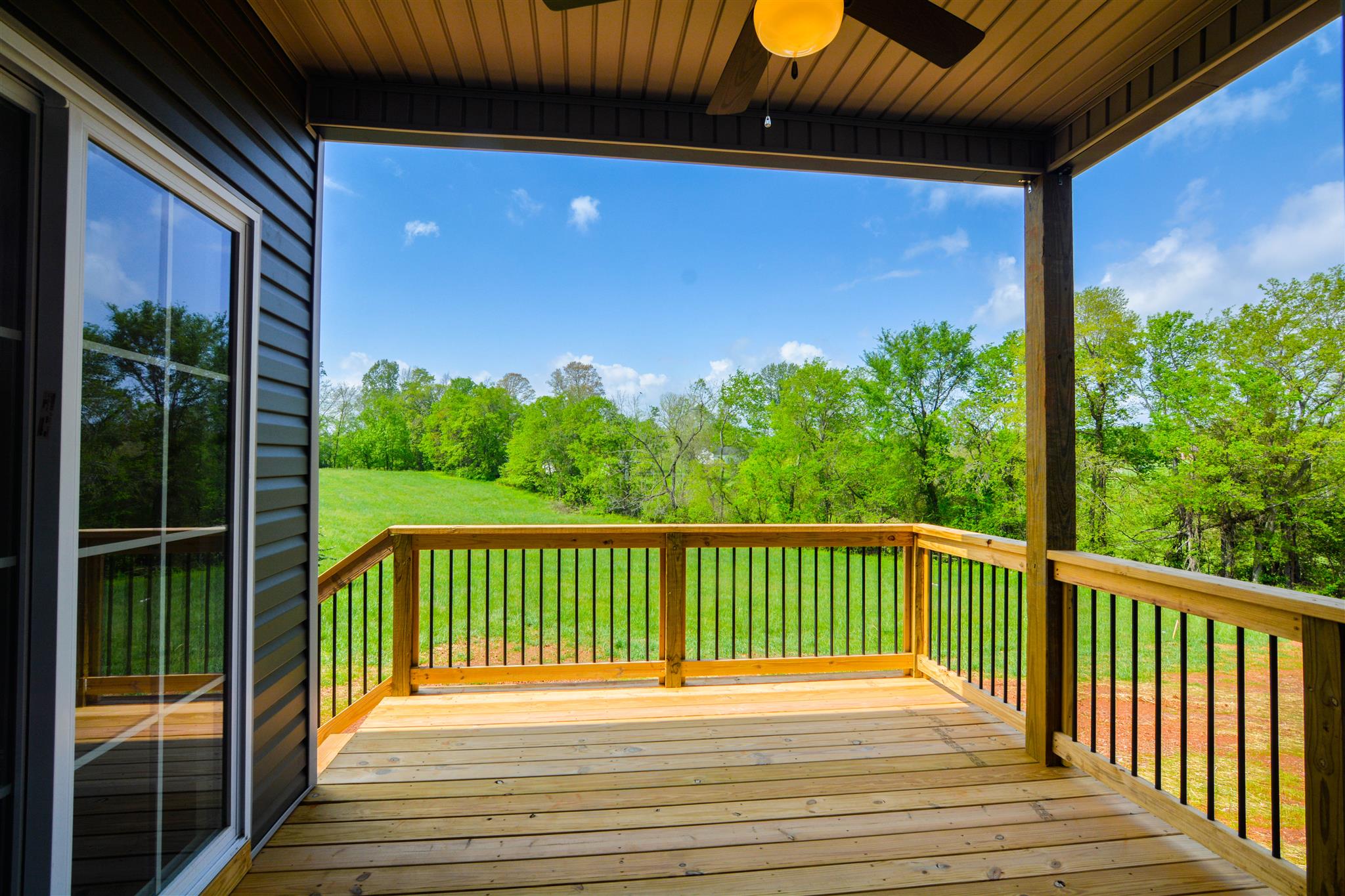 780 Grays Chapel Road Southside, TN 37171 - Photo 4 of 30 a view of a balcony with a floor to ceiling window and wooden fence