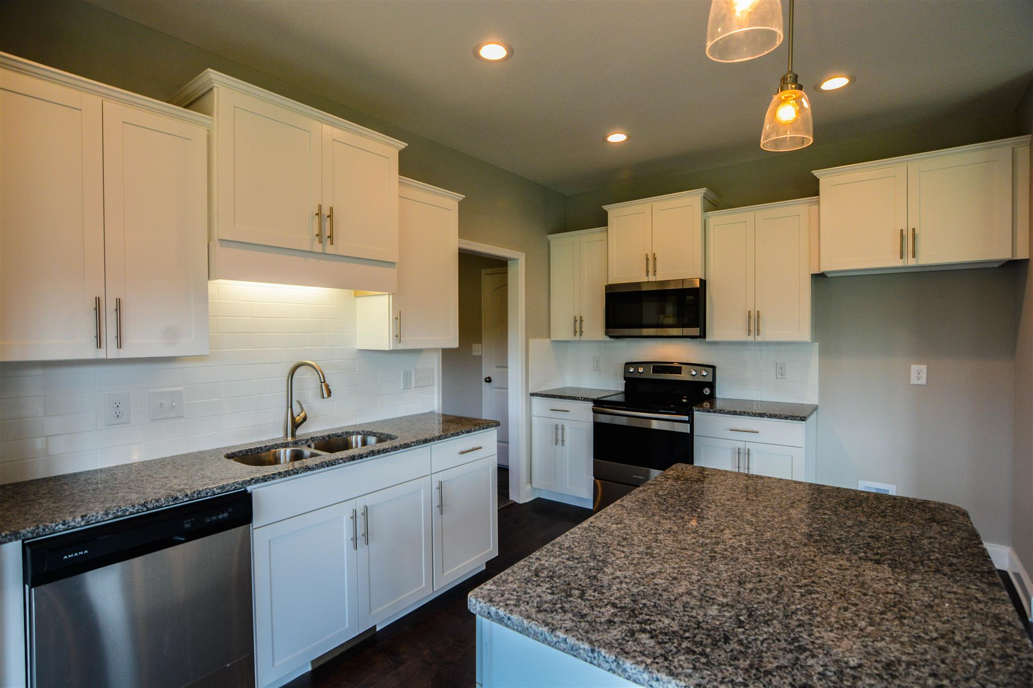 780 Grays Chapel Road Southside, TN 37171 - Photo 7 of 30 a kitchen with a sink stove and refrigerator